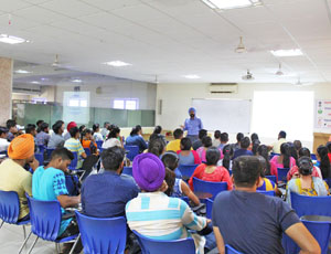 Delegate is delivering lecture to students.